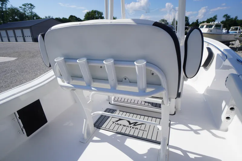 Slide: The Image of 2023 Tidewater 220 CC Adventure boat interior with rod holders and seating. - 34