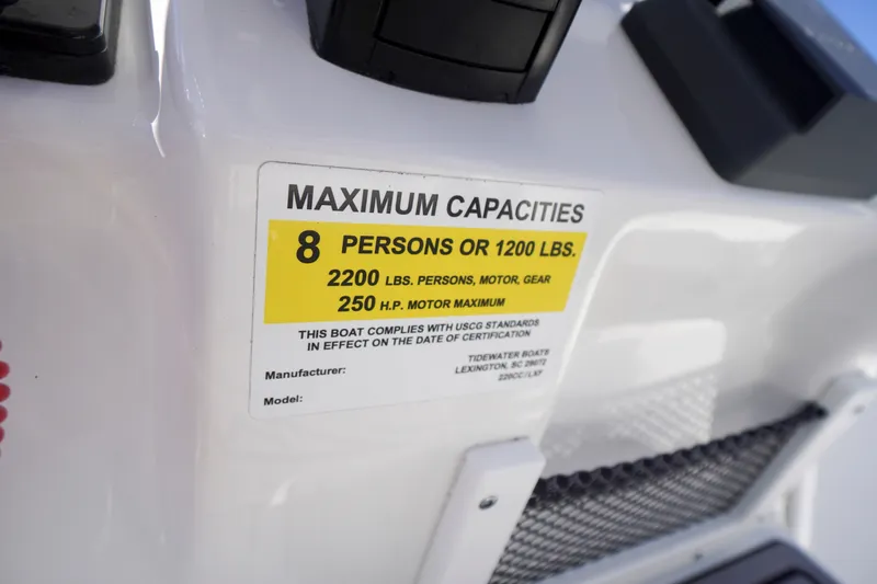 Slide: The Image of 2023 Tidewater 220 CC Adventure boat capacity label, 8 persons or 1200 lbs, 250 HP max. - 33
