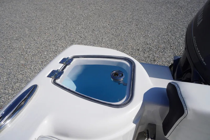 Slide: The Image of 2023 Tidewater 220 CC Adventure boat detail with livewell and engine. - 38