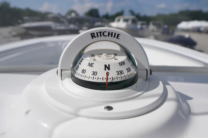 Slide: The Image of Compass on 2023 Tidewater 220 CC Adventure boat, showing north direction. - 28
