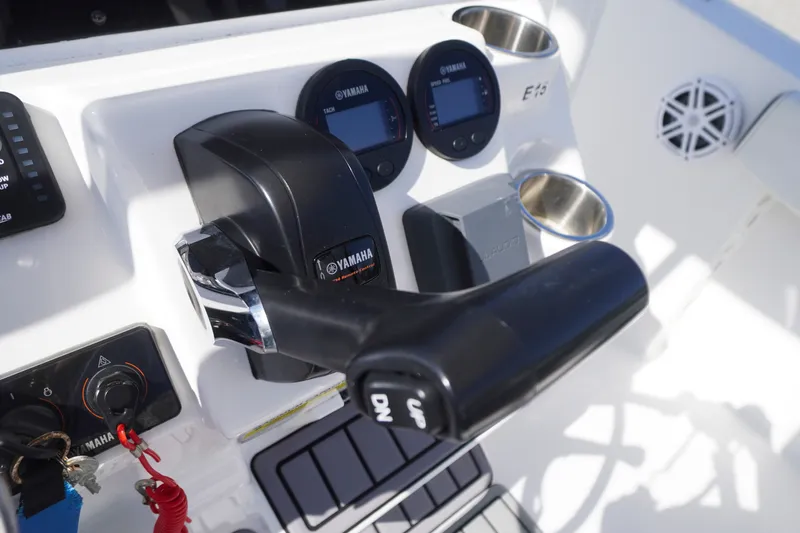 Slide: The Image of Control panel of 2023 Tidewater 220 CC Adventure boat with Yamaha throttle and gauges. - 26