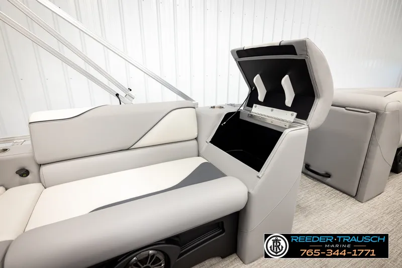Slide: The Image of 2026 Avalon VEN85 RF boat interior with open storage compartment and sleek seating design. - 23