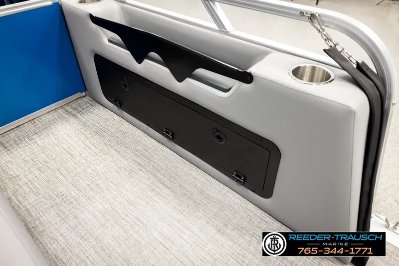 Slide: The Image of 2026 Avalon VEN85 RF boat interior with storage compartment and cup holders. - 32