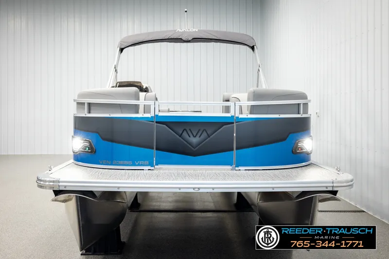 Slide: The Image of 2026 Avalon VEN85 RF pontoon boat in showroom, featuring sleek design and modern amenities. - 8
