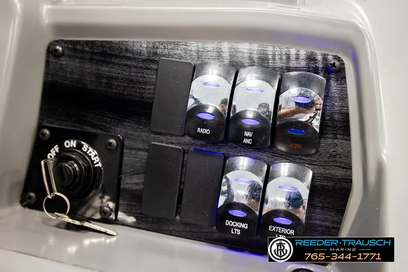 Slide: The Image of Control panel of 2026 Avalon VEN85 RF boat with labeled switches and ignition key. - 39