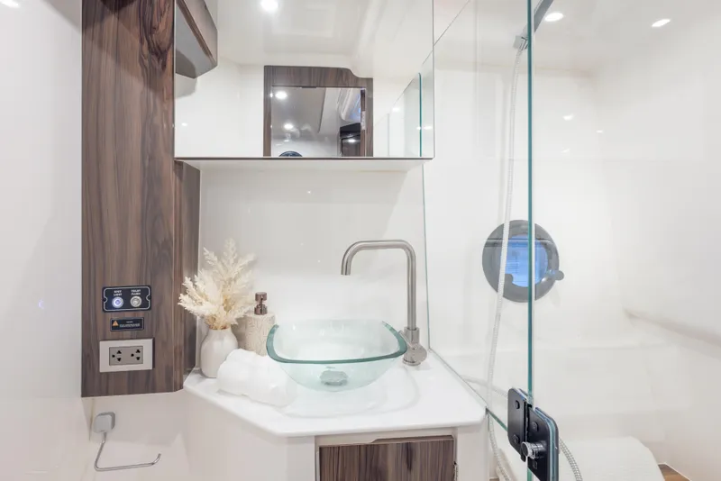 Slide: The Image of Modern bathroom in Hanover 387 yacht, featuring glass sink and sleek design, 2026 model. - 24