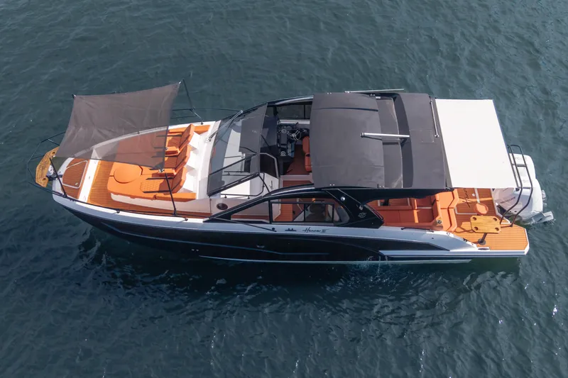 Slide: The Image of Aerial view of 2026 Hanover 387 luxury boat with sunshade on open water. - 25