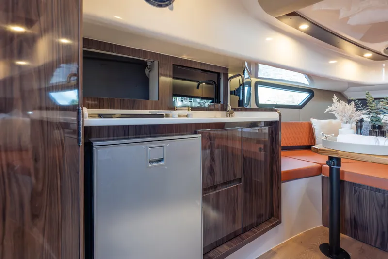 Slide: The Image of Luxurious Hanover 387 yacht interior with modern kitchen and cozy seating, 2026 model. - 17