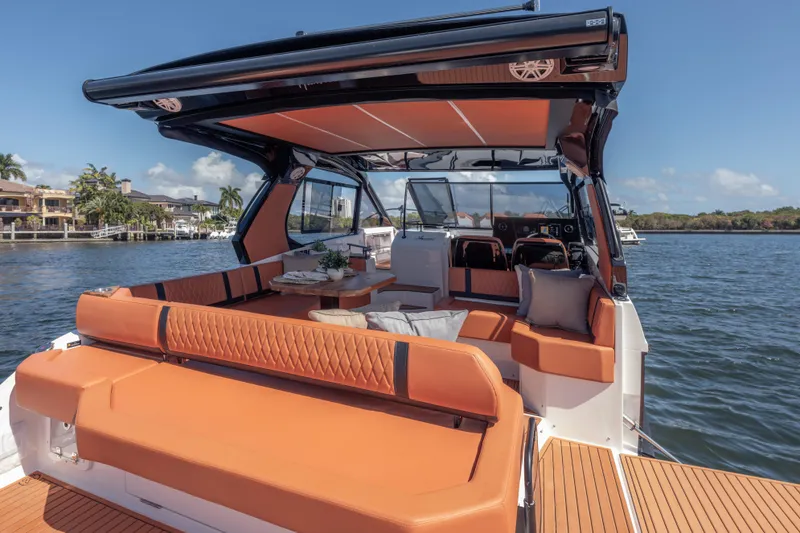 Slide: The Image of Luxurious 2026 Hanover 387 yacht interior with orange seating, cruising on a sunny day. - 12