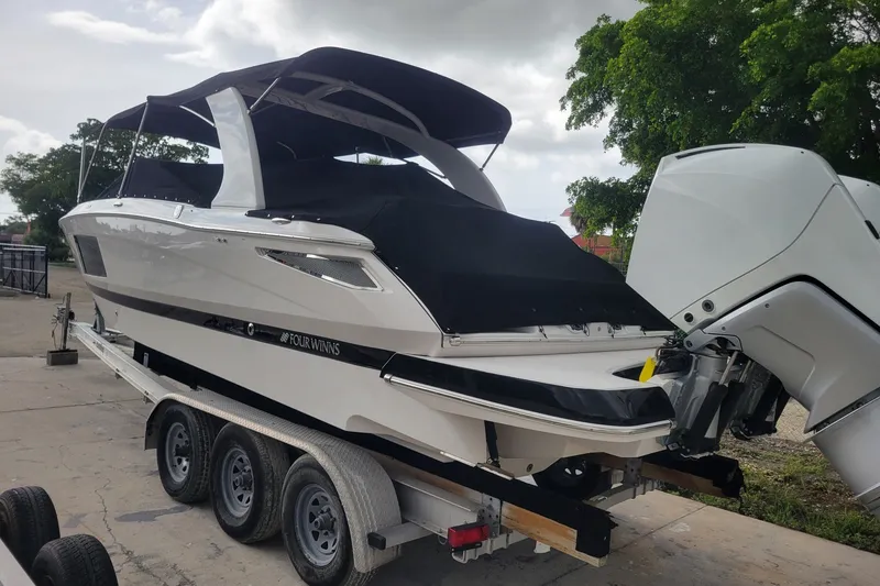 Slide: The Image of 2019 Four Winns H290 OB boat on trailer, covered and ready for transport. - 33