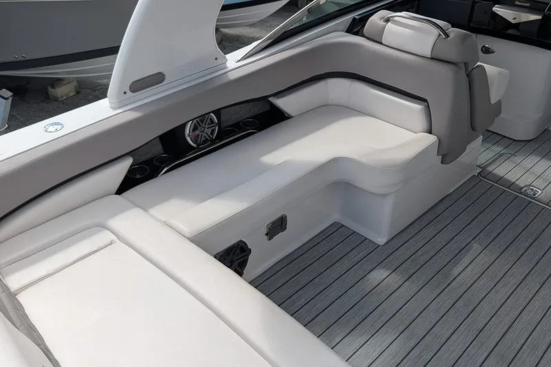 Slide: The Image of 2019 Four Winns H290 OB boat interior with sleek seating and modern design. - 13