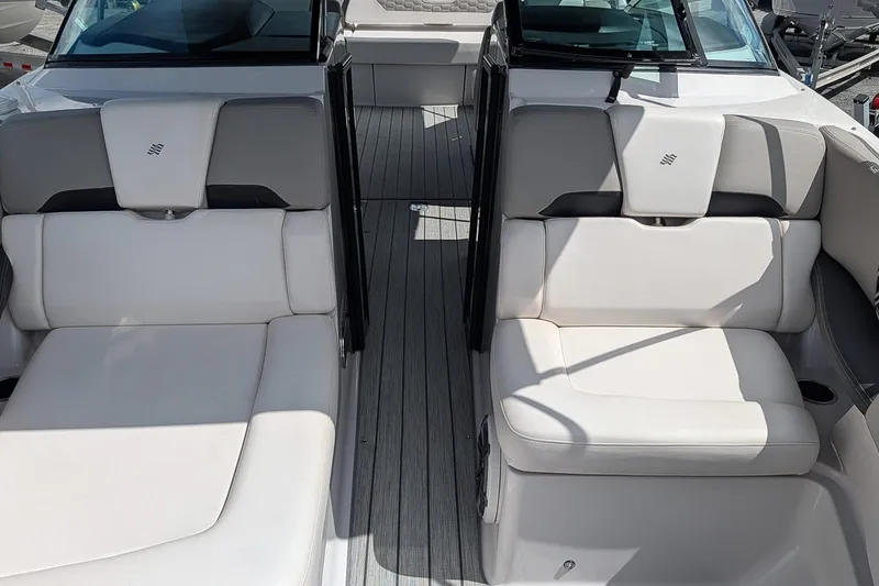 Slide: The Image of 2019 Four Winns H290 OB boat interior with white and gray seating. - 27
