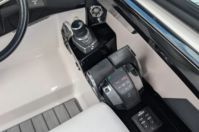 Slide: The Image of Control panel of 2019 Four Winns H290 OB boat, featuring joystick and throttle controls. - 17