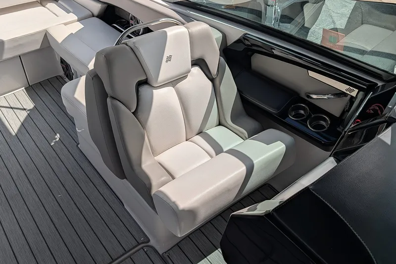 Slide: The Image of Luxurious seating in 2019 Four Winns H290 OB boat, featuring sleek design and cup holders. - 22