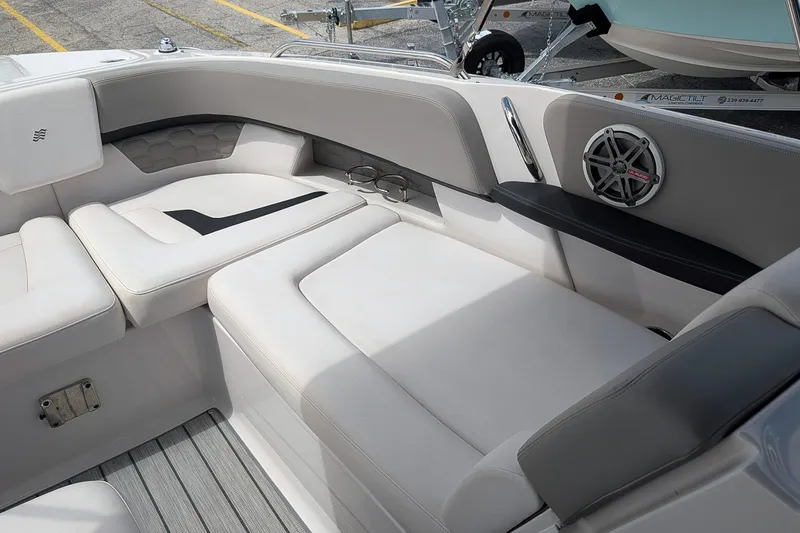 Slide: The Image of Luxurious seating area on 2019 Four Winns H290 OB boat, featuring sleek design and built-in speaker. - 30