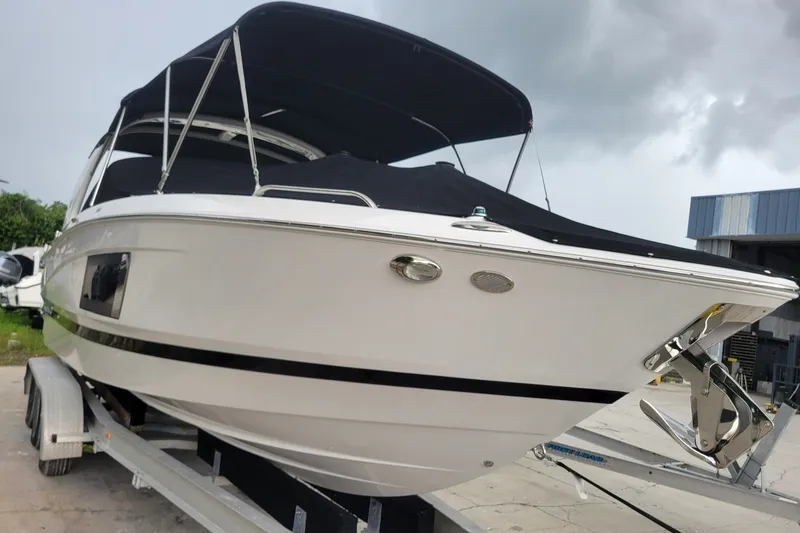 Slide: The Image of 2019 Four Winns H290 OB boat on trailer, covered and ready for transport. - 35