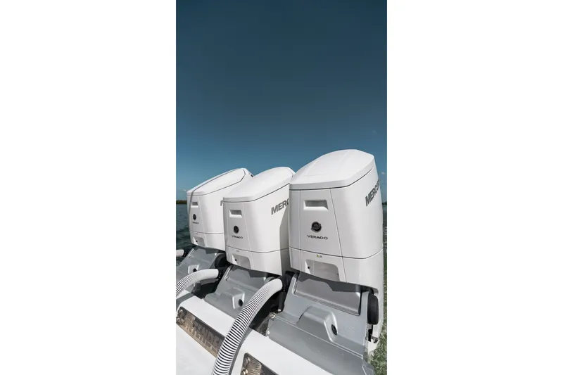 Slide: The Image of Triple Mercury Verado outboard engines on a 2024 Contender 44 Fisharound boat. - 55