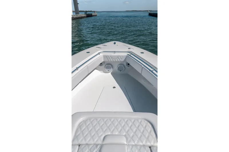 Slide: The Image of 2024 Contender 44 Fisharound boat interior with quilted seating and ocean view. - 47