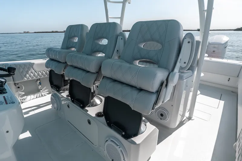 Slide: The Image of 2024 Contender 44 Fisharound boat interior with luxurious seating and ocean view. - 35