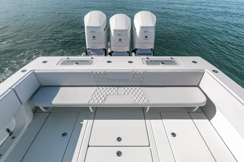 Slide: The Image of 2024 Contender 44 Fisharound boat with triple outboard engines on open water. - 31