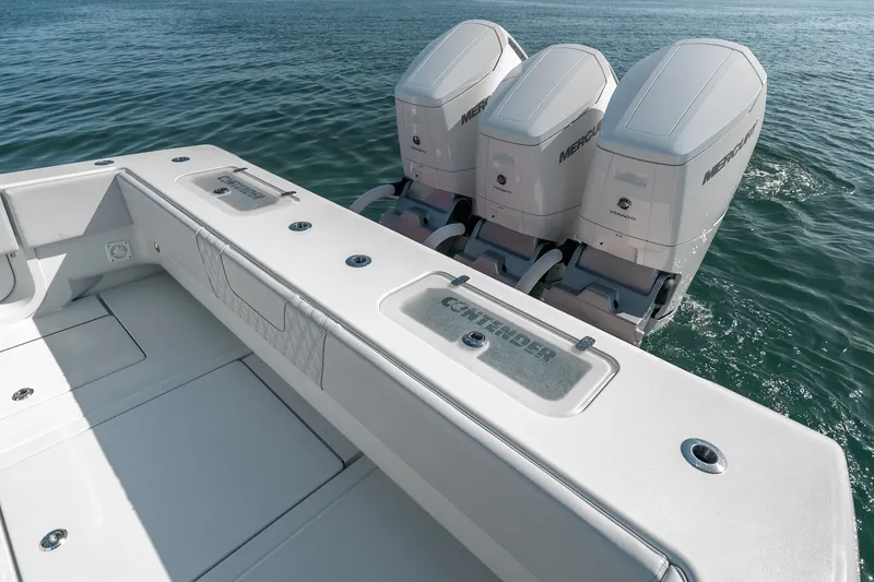 Slide: The Image of 2024 Contender 44 Fisharound boat with triple Mercury engines on open water. - 40
