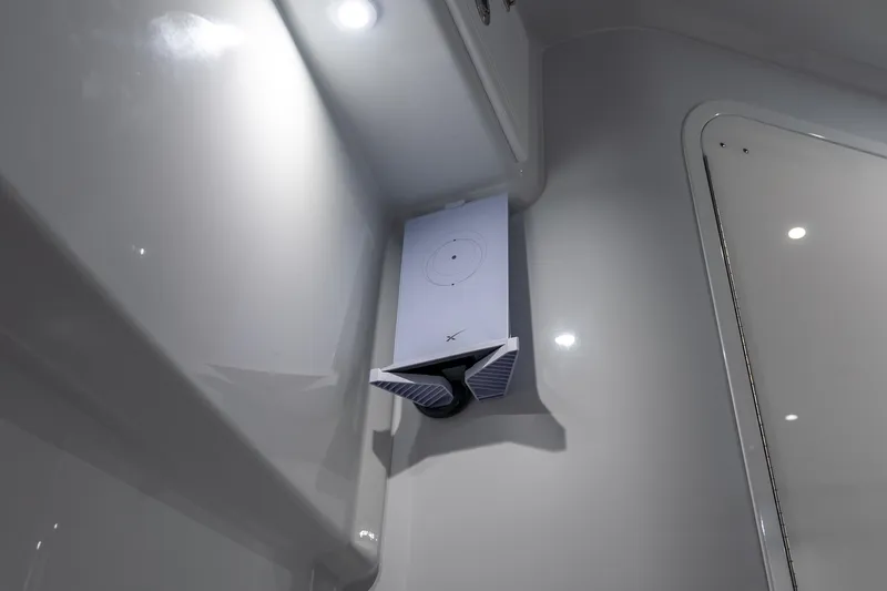Slide: The Image of 2024 Contender 44 Fisharound interior with mounted electronic device and LED lighting. - 16