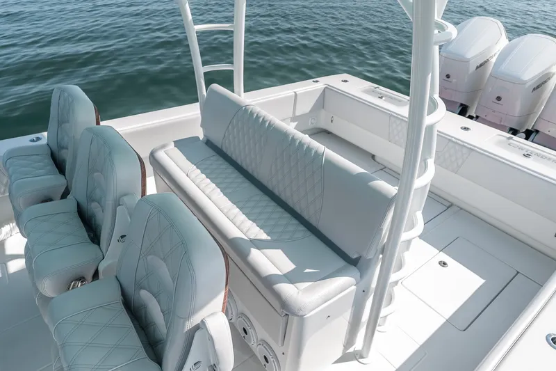 Slide: The Image of 2024 Contender 44 Fisharound boat interior with luxurious seating and ocean backdrop. - 39