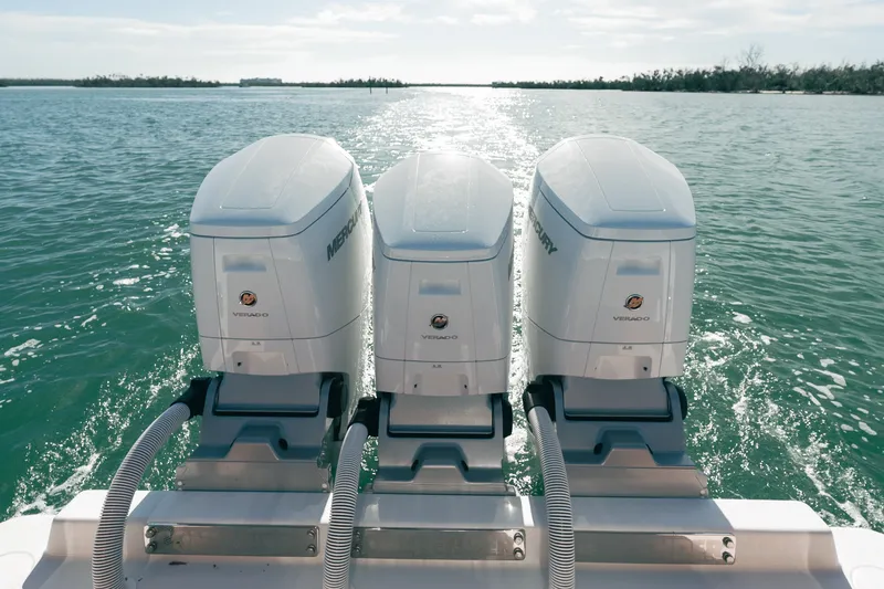 Slide: The Image of Triple Mercury Verado engines on 2024 Contender 44 Fisharound, cruising on open water. - 20