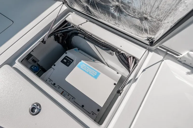Slide: The Image of 2024 Contender 44 Fisharound boat compartment with electrical equipment and wiring. - 23