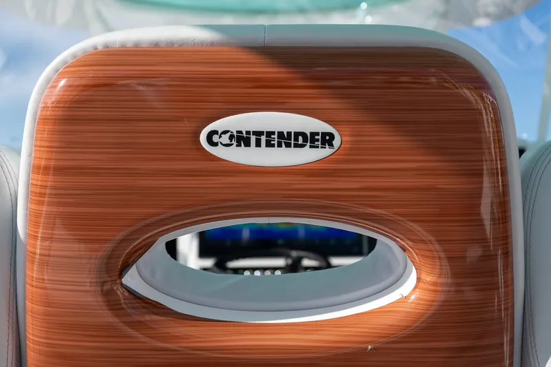 Slide: The Image of 2024 Contender 44 Fisharound boat seat with logo, featuring sleek wood finish. - 6