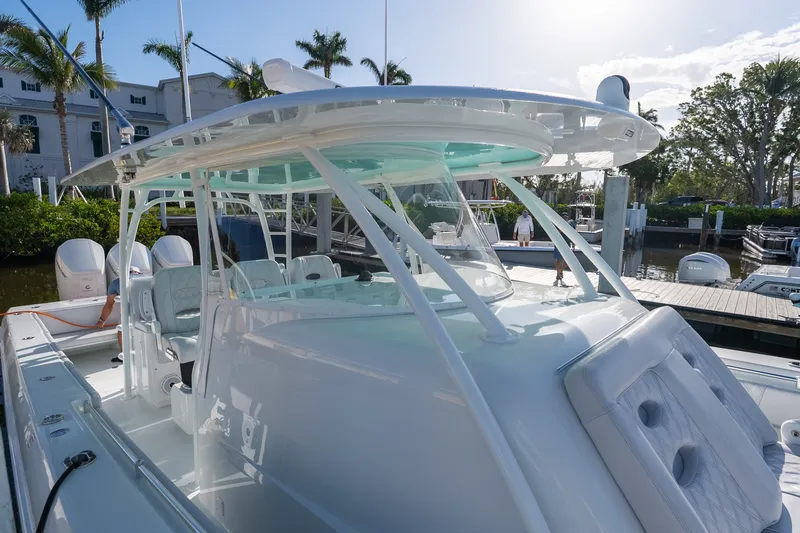 Slide: The Image of 2024 Contender 44 Fisharound boat docked, showcasing sleek design and modern features. - 3