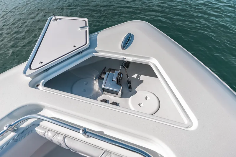 Slide: The Image of 2024 Contender 44 Fisharound anchor compartment, open hatch, on calm water. - 29