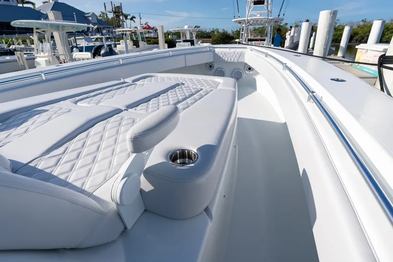 Slide: The Image of 2024 Contender 44 Fisharound boat with luxurious white seating and cup holders. - 4