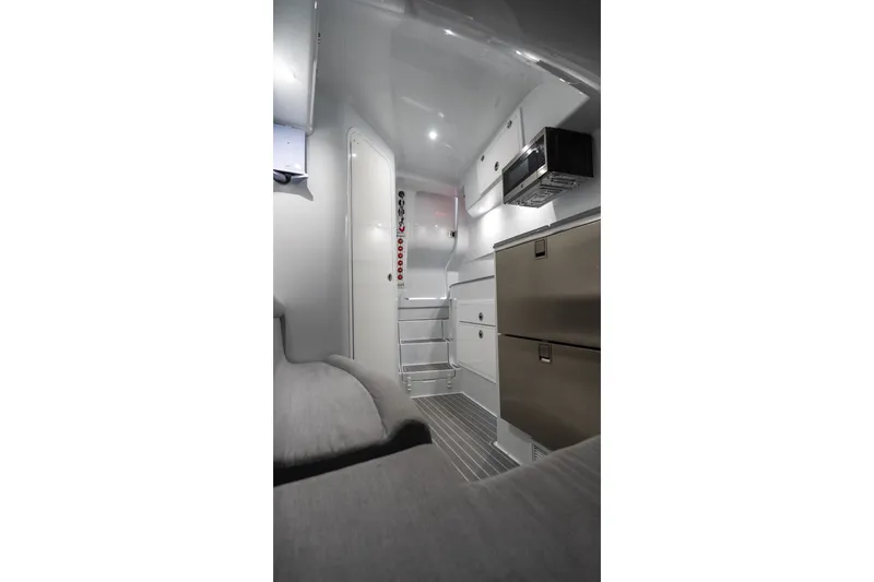 Slide: The Image of Interior of 2024 Contender 44 Fisharound boat, featuring modern cabinetry and sleek design. - 65