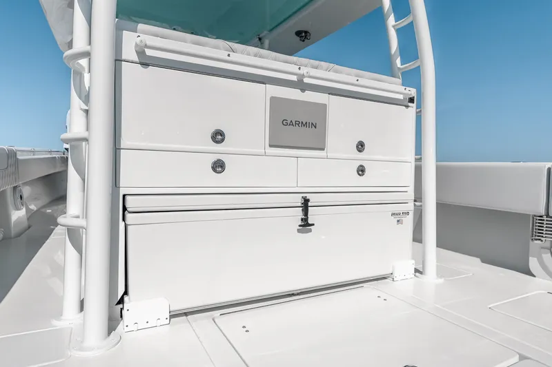 Slide: The Image of 2024 Contender 44 Fisharound boat with Garmin equipment, featuring sleek white cabinetry. - 36