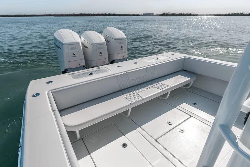 Slide: The Image of 2024 Contender 44 Fisharound boat with triple Mercury engines on calm water. - 32