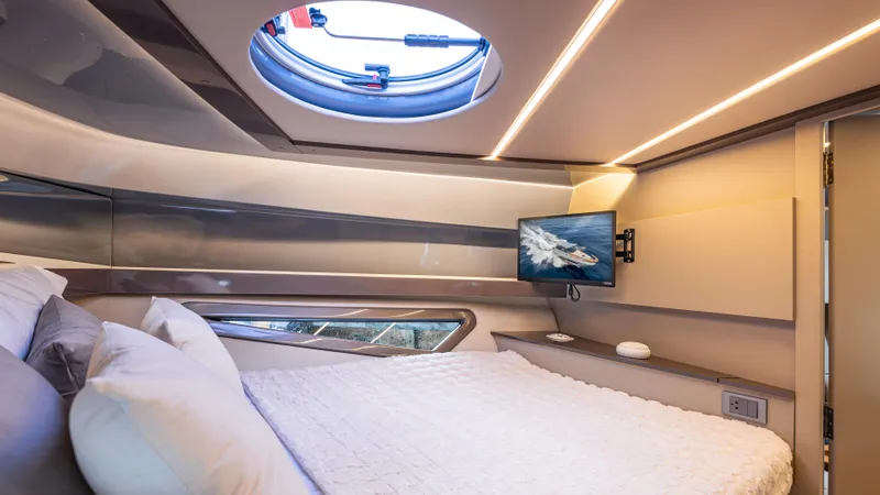 Slide: The Image of Luxurious 2025 Hanover 415 yacht cabin with modern design and cozy bedding. - 6