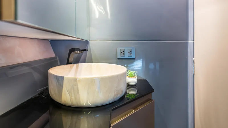 Slide: The Image of Modern bathroom sink with marble basin and sleek design, Hanover 415, 2025 model. - 9
