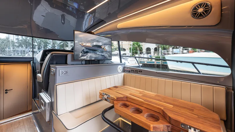 Slide: The Image of Luxurious interior of a Hanover 415 yacht with an elegant seating area and wooden table. - 22