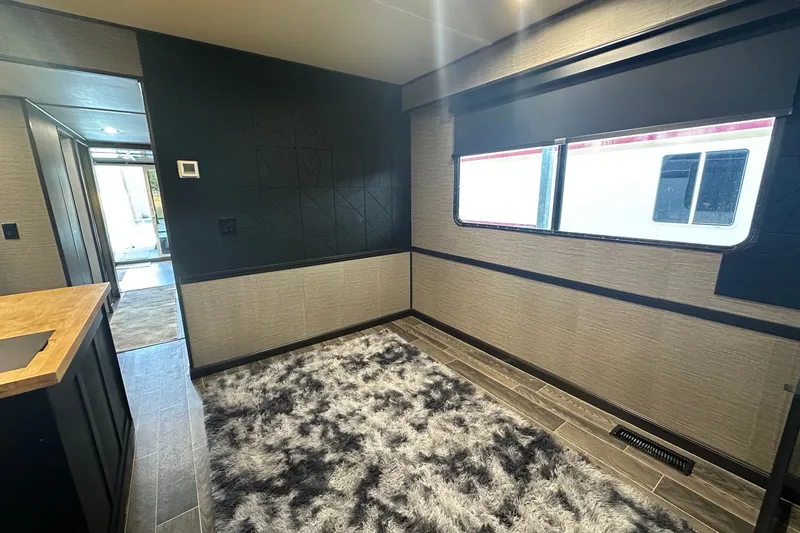 Slide: The Image of Interior of 1988 Stardust Cruisers 16x65 with modern decor and large window. - 5