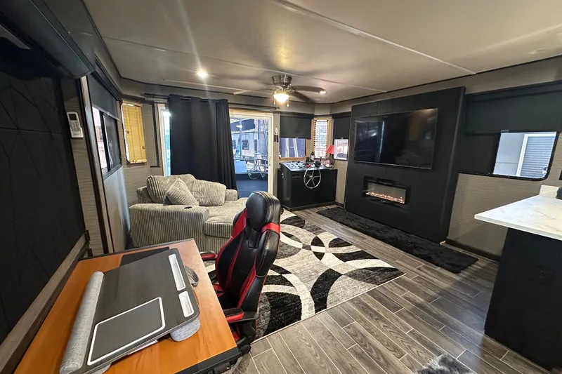 Slide: The Image of Luxurious interior of a 1988 Stardust Cruisers 16x65 houseboat with modern decor and amenities. - 3