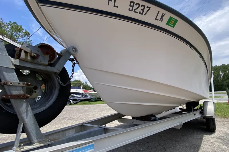 Slide: The Image of 1998 Grady-White Tournament 192 boat on trailer, parked outdoors. - 5