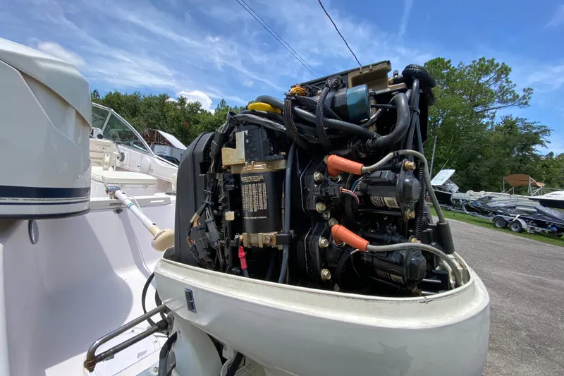 Slide: The Image of 1998 Grady-White Tournament 192 boat engine, detailed view, outdoors. - 18