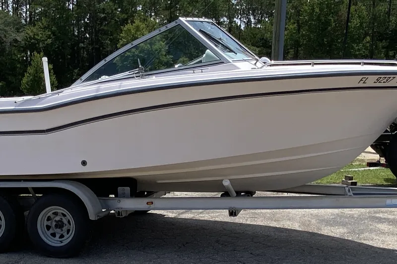 Slide: The Image of 1998 Grady-White Tournament 192 boat on trailer, side view, outdoors. - 2