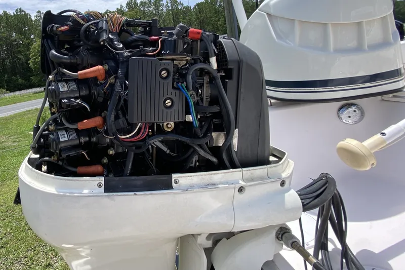 Slide: The Image of Close-up of a 1998 Grady-White Tournament 192 boat engine, showing detailed components. - 15