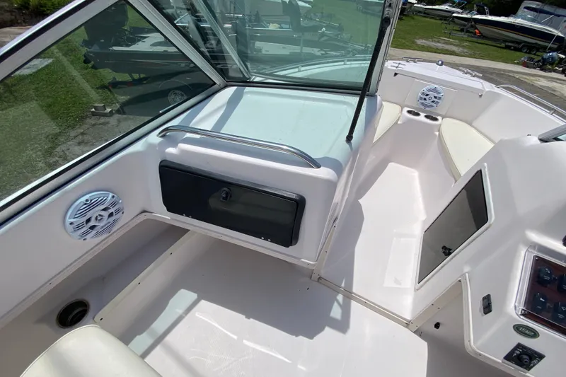 Slide: The Image of 1998 Grady-White Tournament 192 boat interior with seating and dashboard view. - 10
