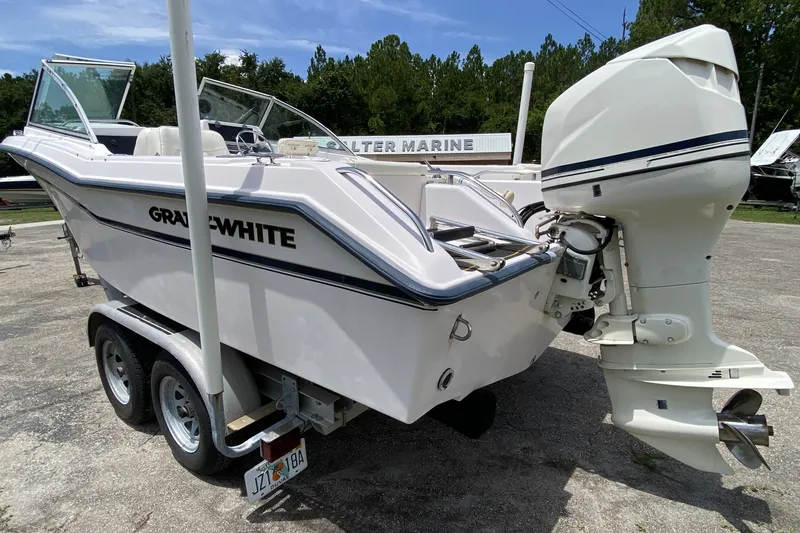 Slide: The Image of 1998 Grady-White Tournament 192 boat on trailer, featuring outboard motor. - 3