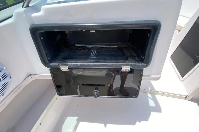 Slide: The Image of Open storage compartment on 1998 Grady-White Tournament 192 boat. - 14