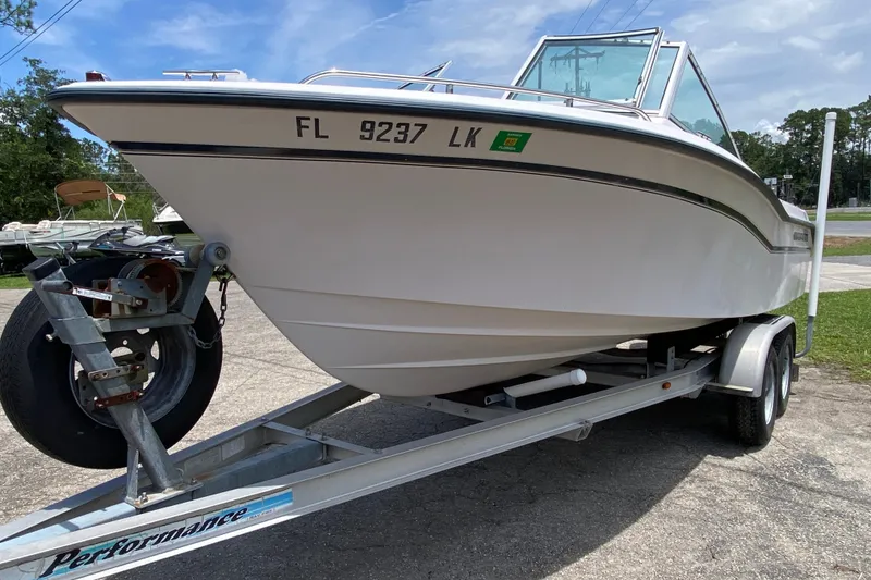 Slide: The Image of 1998 Grady-White Tournament 192 boat on trailer, parked outdoors. - 4
