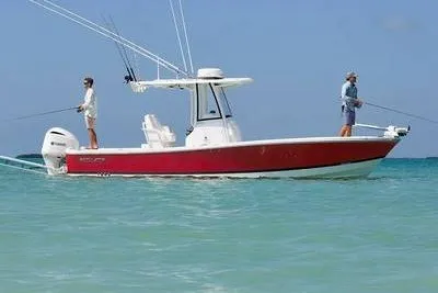 The Image of 2027 Regulator 26XO boat with anglers fishing in calm blue waters. - 1